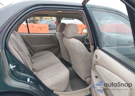 2000 Toyota Corolla Le from USA, damaged, VIN 1NXBR18E3YZ305285